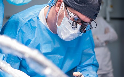 Dentist performing surgery