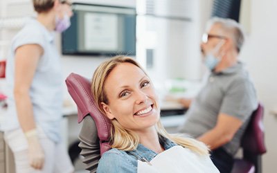 Woman smiling in the dental chair