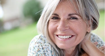 Smiling older woman outdoors