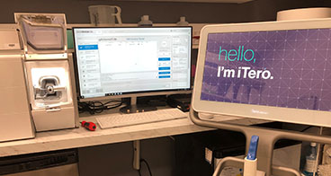 Dental office software on computer screens