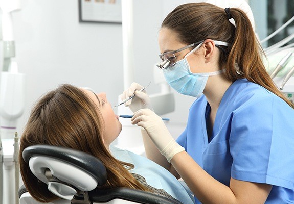 Dental patient receiving impacted canine treatment