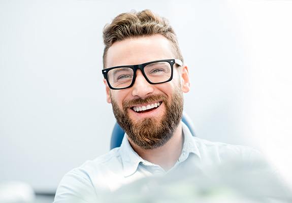 Smiling man in dental chair