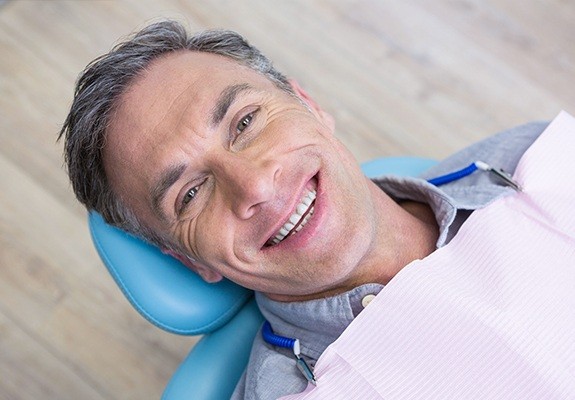 Smiling man in dental chair