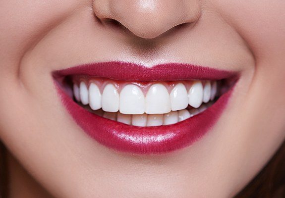 Close up of woman with red lipstick smiling