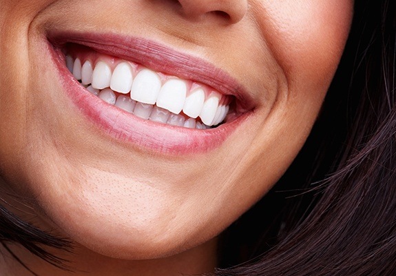 Closeup of patient's healthty smile after gum regeneration