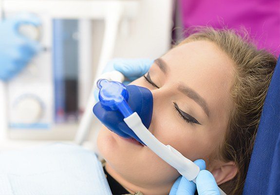 Woman with nitrous oxide nasal mask