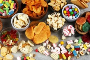 Table spread with foods to avoid after dental implant surgery