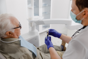 a patient during their dental implant consultation